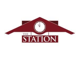 Clock tower at Mission Bell Communications station, showcasing reliable broadcasting.